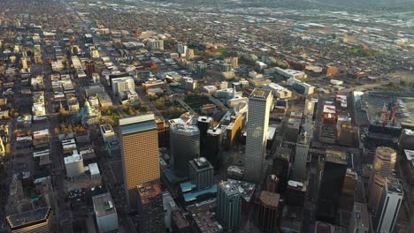 aerial view, downtown denver, colorado usa, skyscrapers in financial center and neighborhood on golden hour sunset sunlight, drone shot