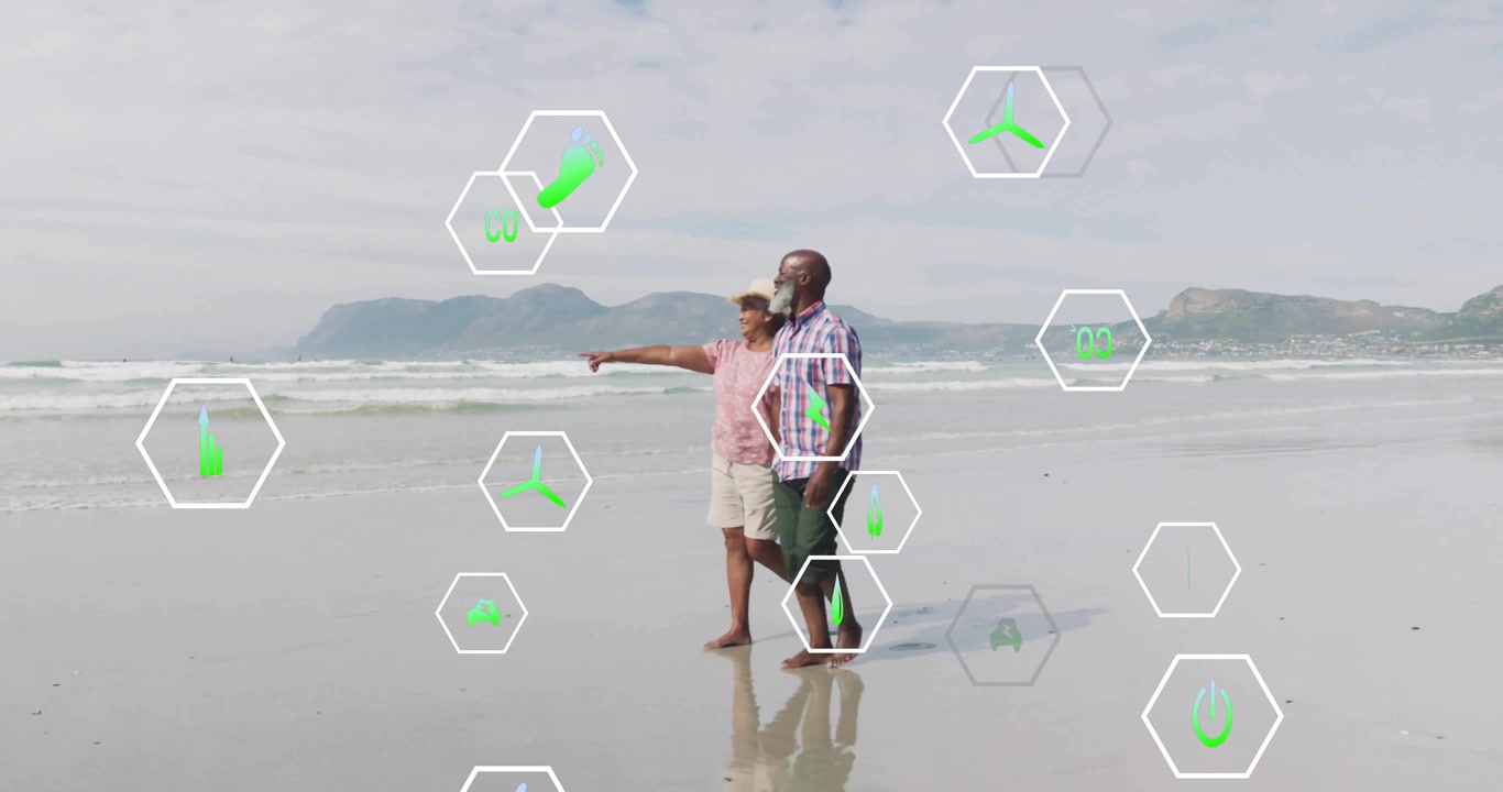 Casal idoso caminhando pela praia, mulher apontando para o horizonte revelando ícones de sustentabilidade flutuando.