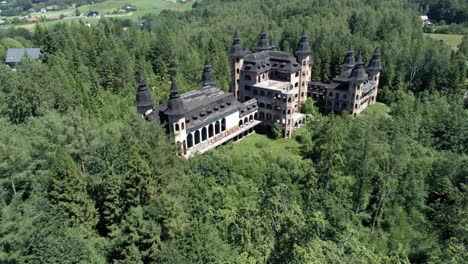 fly above tree tops and reveal majestic building of lapalice castle