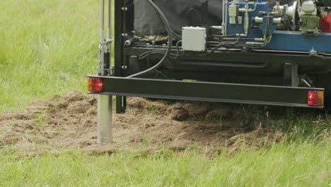 soil examination of agronomy. geotechnical investigation. collecting black soil on the field for examination and analysis. special equipment for pickup