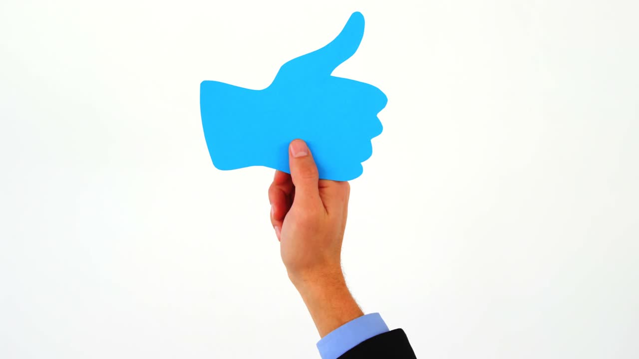 hombre de negocios con los pulgares en alto