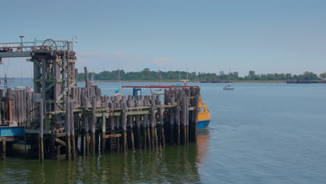 Roll-on,-roll-off-orange-ferry-leaving-the-dock-at-City-Island