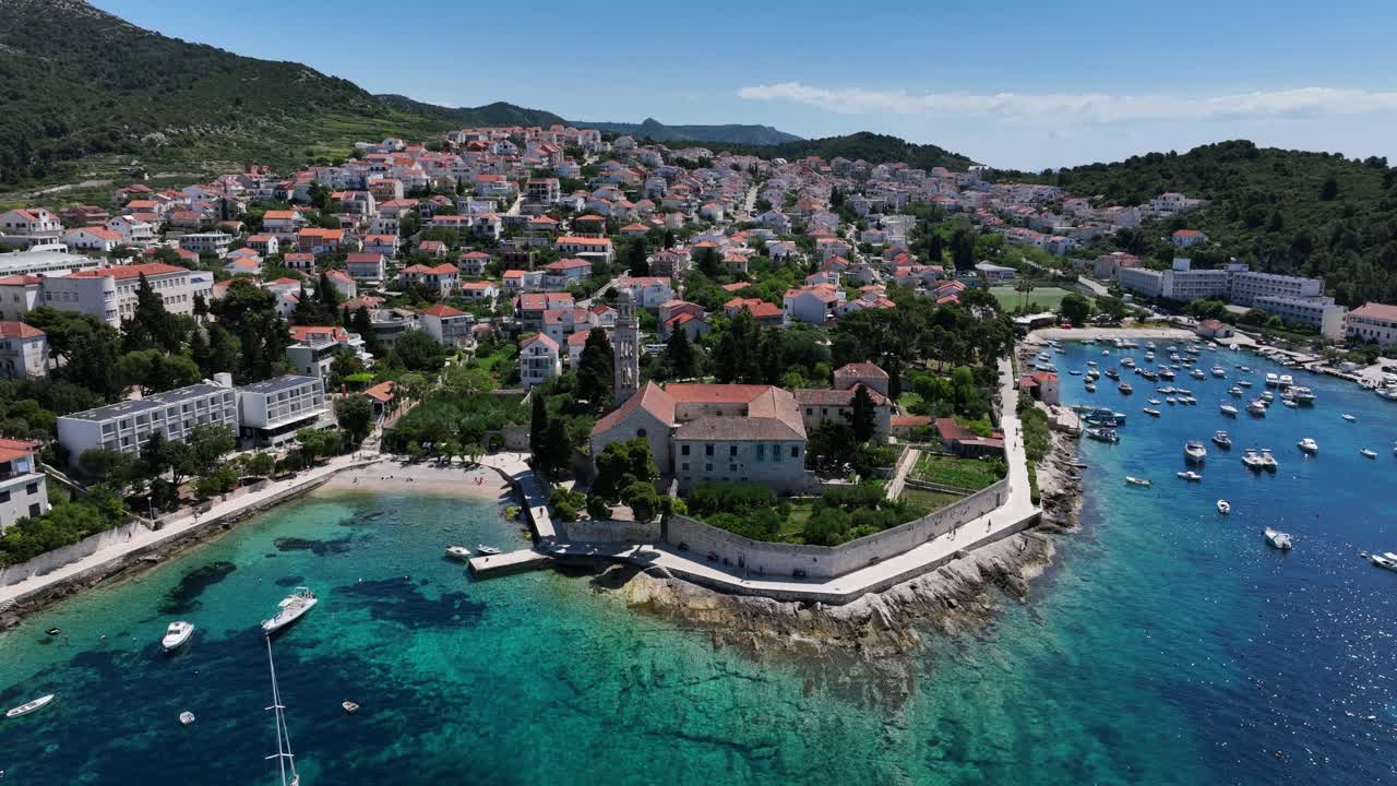 Port And Resort Town On The Croatian Island Of Hvar. Aerial Drone Shot
