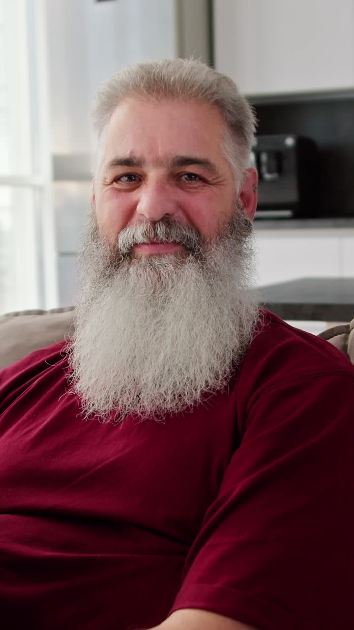 Smiling older man with long white beard