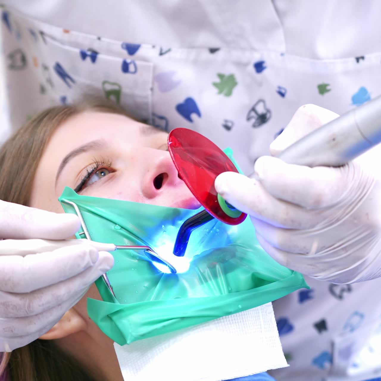 Dentist Working With Female Teeth