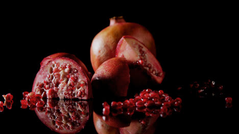 pomegranate on black background 4k