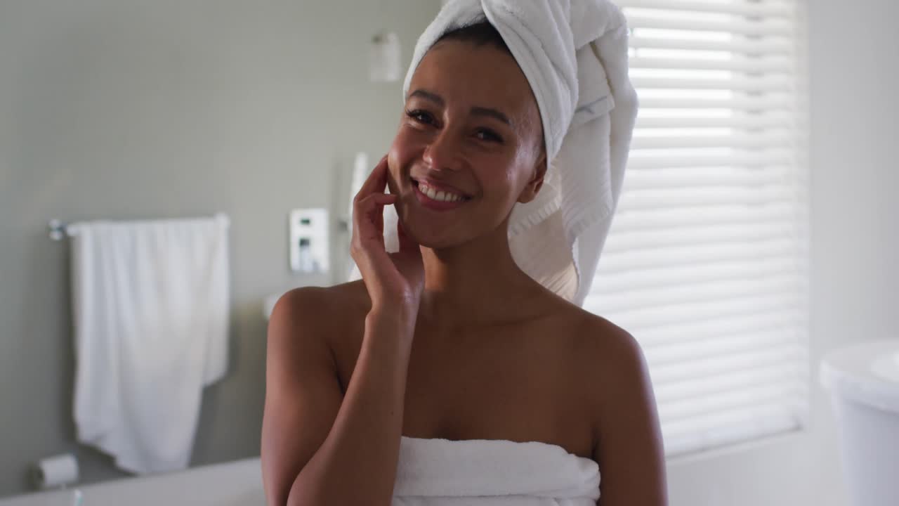 Portrait of african american woman smiling in the bathroom