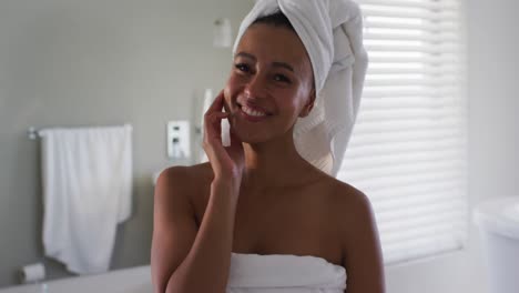 Portrait-of-african-american-woman-smiling-in-the-bathroom