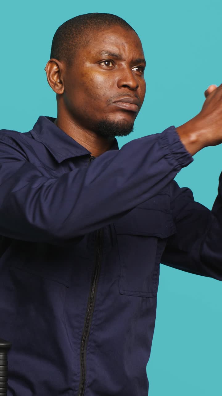 Serious African American Man Rubbing Hands and Aiming