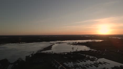 Drone-shot-of-the-sun-setting-over-Ireland's-expansive-landscape