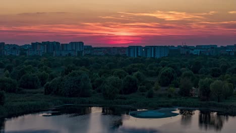 aerial view timelapse over vacaresti delta at sunset, orange, yellow, bucharest, romania