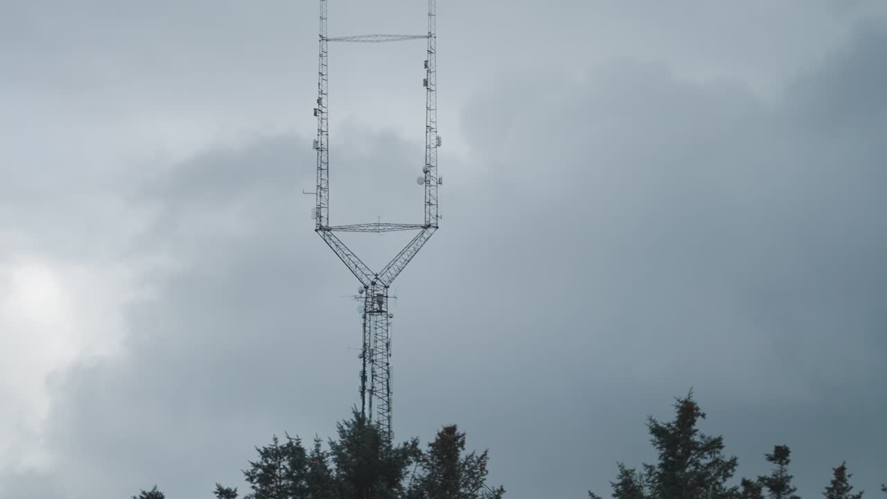 5G antennae tower against the dark sky