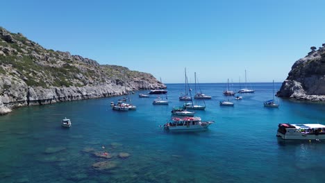 anthony quinn bay in faliraki, rhodes in greece during the day with crystal clear water