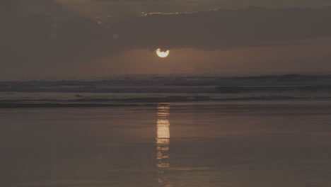 sunset over the ocean at the beach
