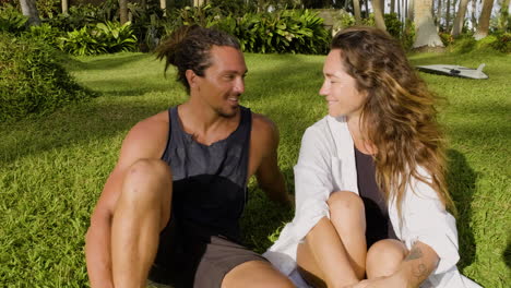 young couple sitting on the grass