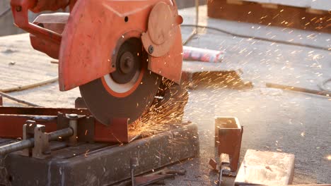 cutting steel channel (steel c chanel) with grinder. sparks while grinding iron