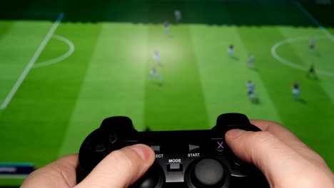 the hand of a young man playing a football compute 4k 2025 08 04 22 08 22 utc.mov | background, close up, closeup, color
