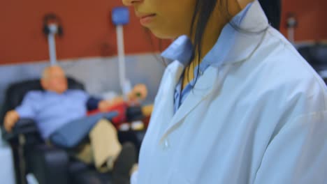 laboratory technician using digital tablet 4k