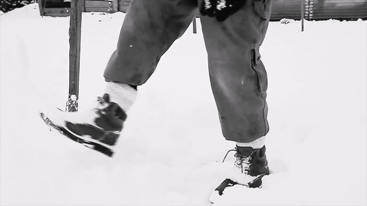 playing in snow and kicking snow on a Winter's day stock footage stock video