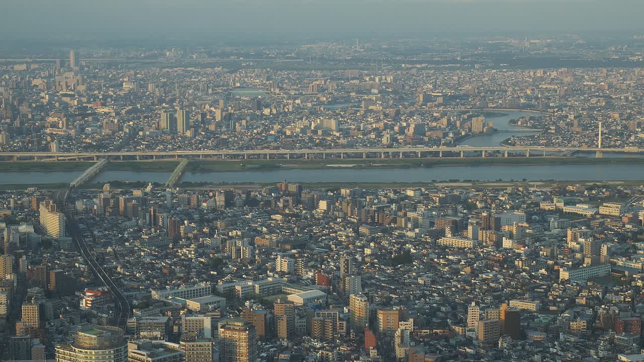 Tokyo Skytree And The Surrounding Cityscape With The Arakawa River In Sumida, Tokyo, Japan. Aerial Shot