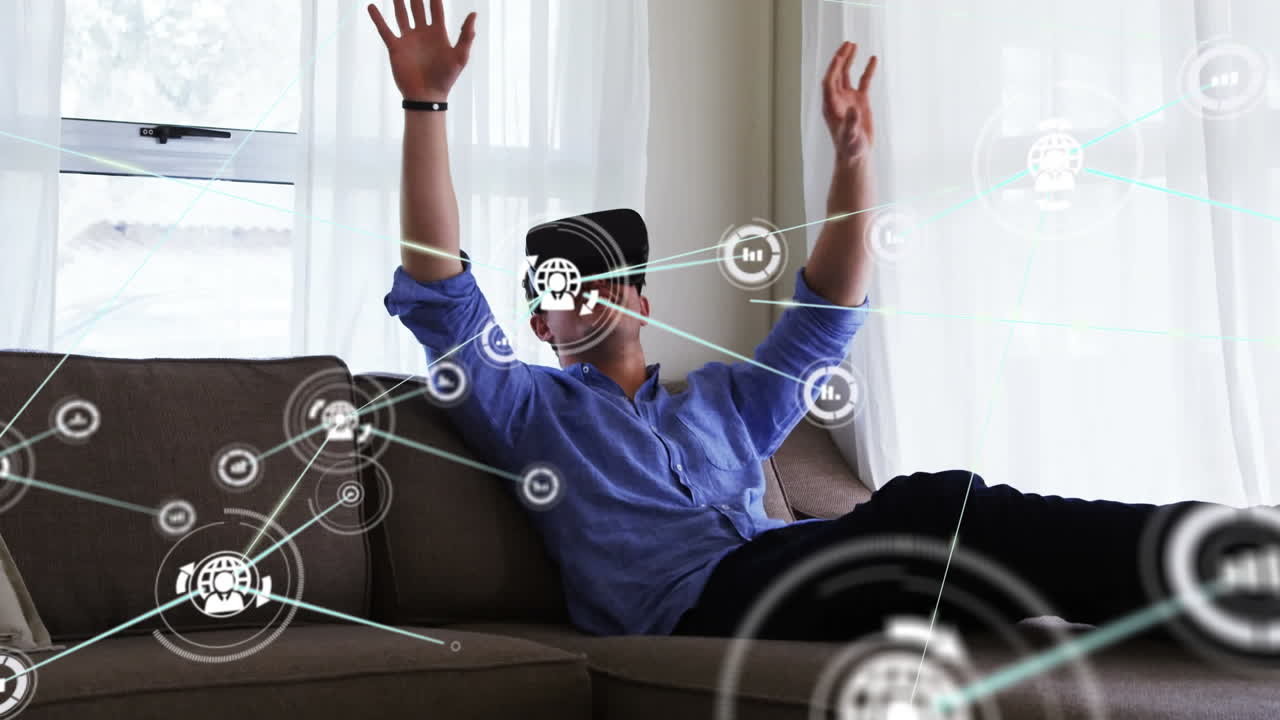 Animation of network of connections with icons over businessman wearing vr headset