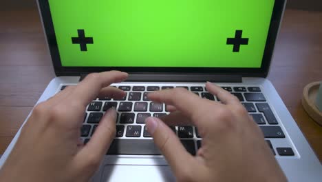 woman hands typing and scrolling on a trackpad in a laptop computer laptop close-up. track points with an angled perspective pin. home office and remote work