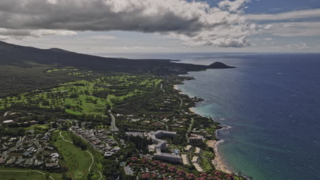 wailea-makena maui hawaii aerial v9 high altitude flyover emerald golf course capturing oceanfront resort hotels, polo beach, blue ocean and mountain landscape - shot with mavic 3 cine - december 2022