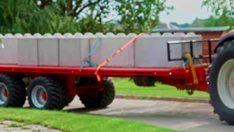 large interlocking concrete security blocks barriers transport by rural tractor