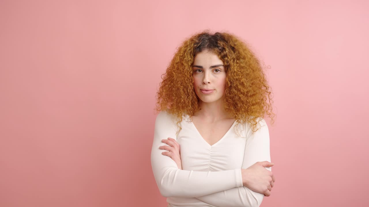 Young woman showing different facial expressions on pink background