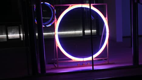 Bright-light-spinning-wheel-within-Canary-Wharf,-London,-United-Kingdom
