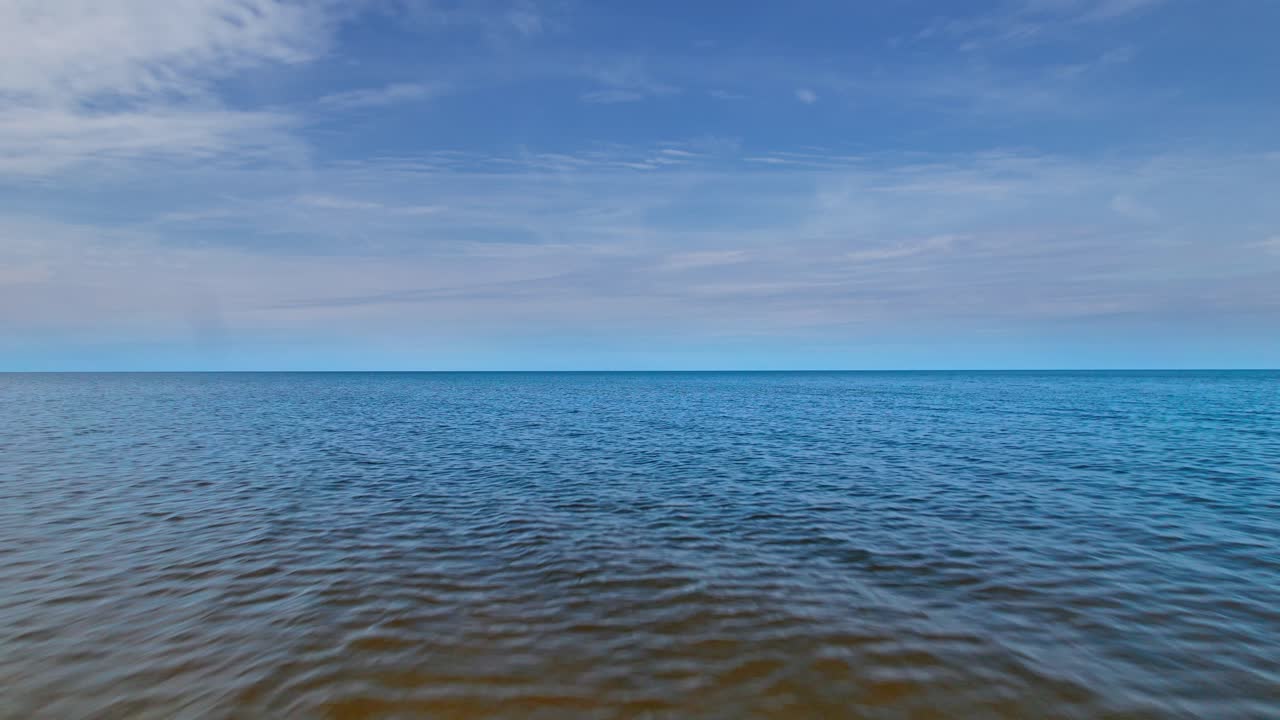 Vast calm waters of the baltic sea captured over latvia's coastline