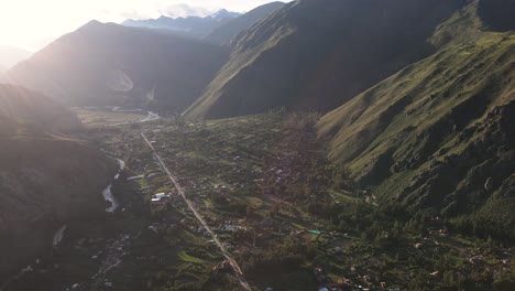 drohne tilt up of lightning sacred valley in cusco,peru during golden sunrise