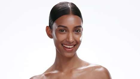 Face-of-Indian-woman-wink-with-cream-for-skincare