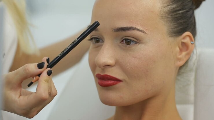 Woman At Beaty Salon. Young woman lies at beaty salon and speak with cosmetologist