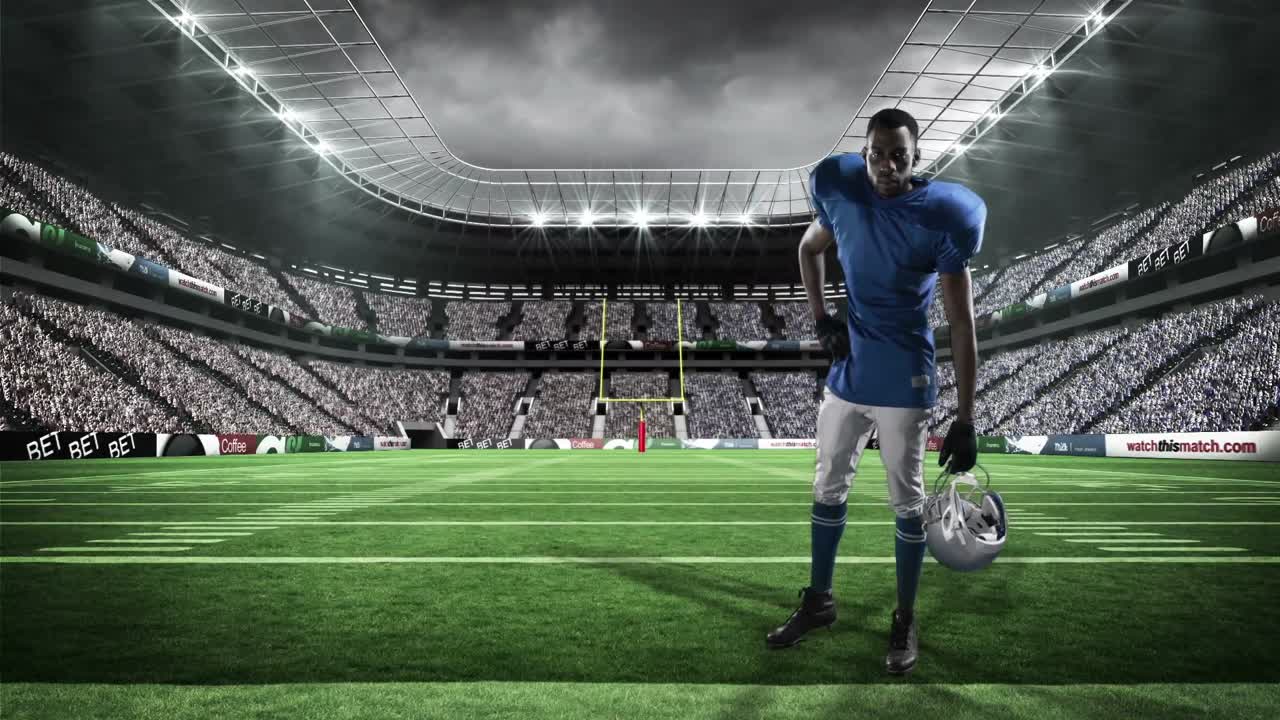 헬 ⁇ 을 들고 있는 미식축구 선수