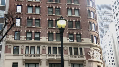 lamp post in front of early twentieth century buildings