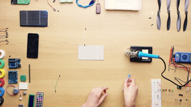 Soldering Circuit Board Components on a Workspace