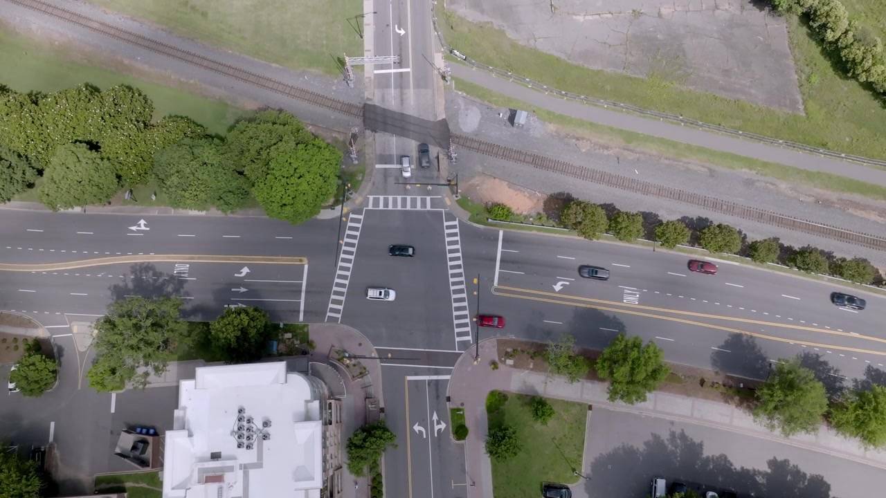 Traffic at an intersection in downtown Rock Hill, South Carolina with drone video overhead.