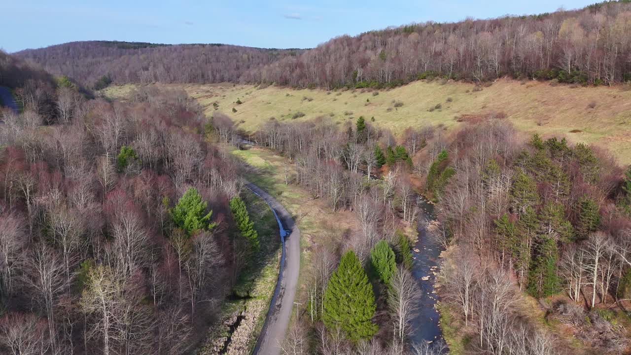 Winding road and flowing stream of North Fork Blackwater River, West Virginia, USA