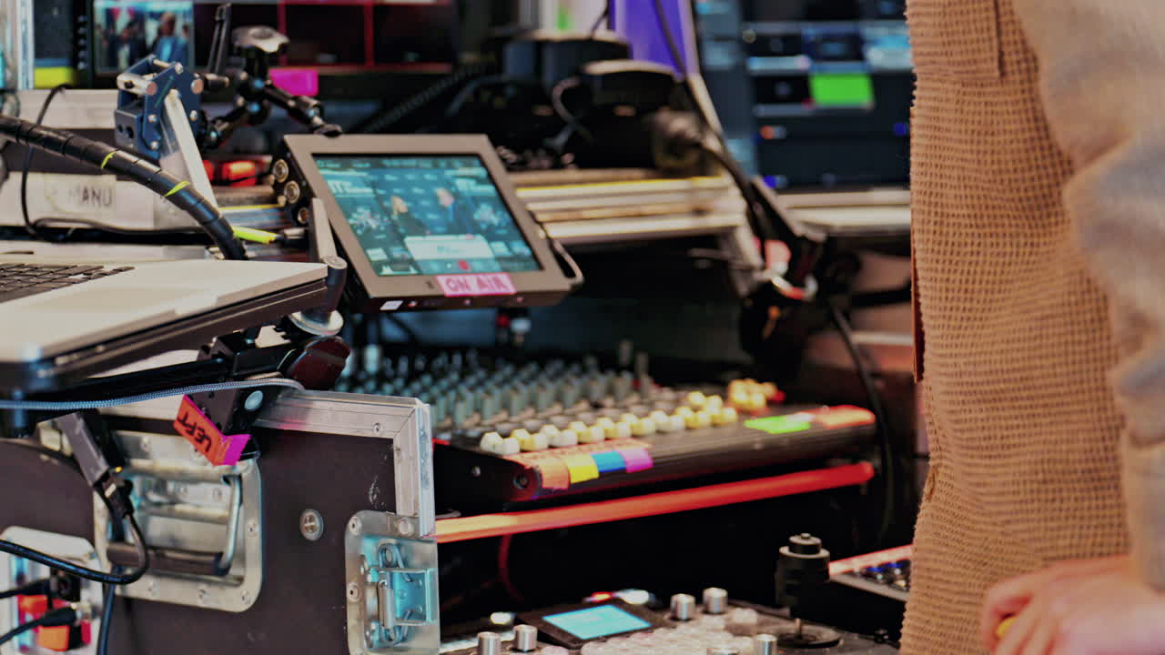 Behind-the-scenes look of media production with professional equipment at a conference, on air