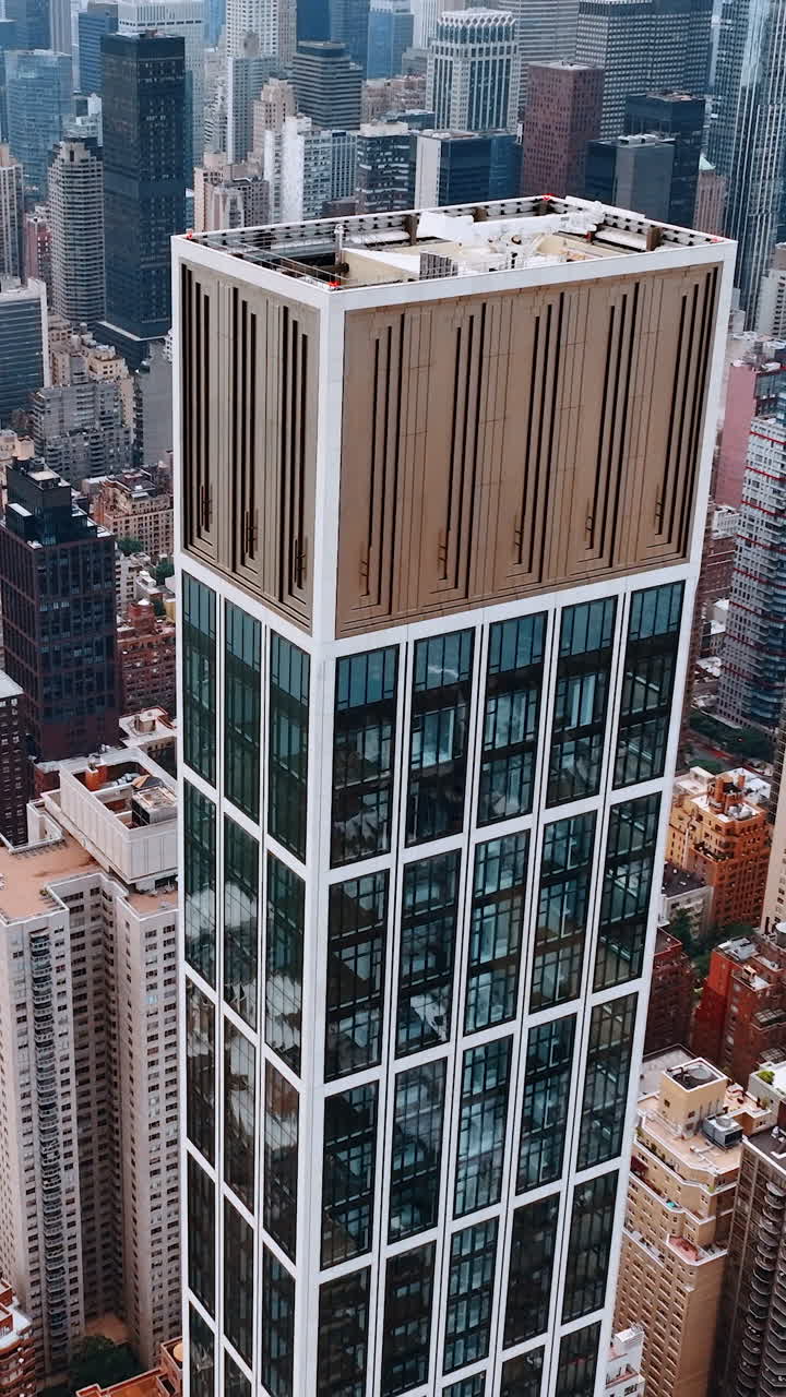Gorgeous skyscrapers overpeer above the city panorama. Breath-taking view of New York at daytime from top. Vertical video