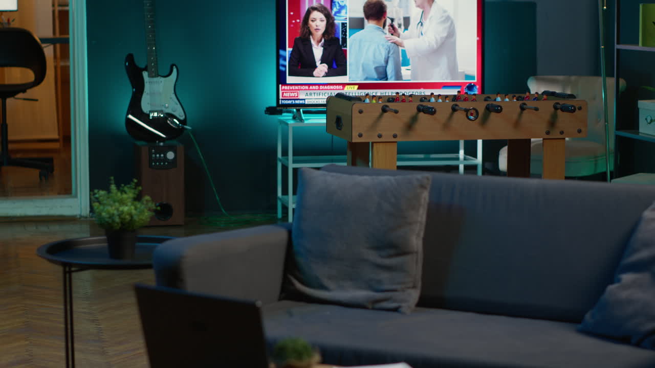 Modern apartment loft with a cozy corner and trendy decorations, comfy space decorated with electronics and a coffee table in the living room. Empty studio with minimalist furniture, chill lifestyle.