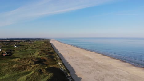 aerial view of the north sea shoreline outside løkken, denmark, with white sand beach