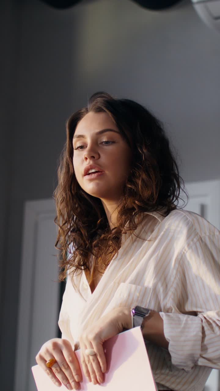 Woman presenting or discussing documents