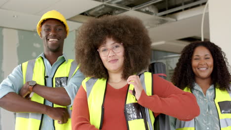 portrait of smiling casual diverse architects working in office, slow motion with copy space