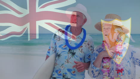 pareja de ancianos en ropa de playa con tabla de surf sobre union jack y animación de la bandera de anguilla