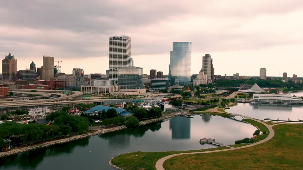 A costal aerial view the city of Milwaukee overlooking a small peninsula off of Lake Michigan.