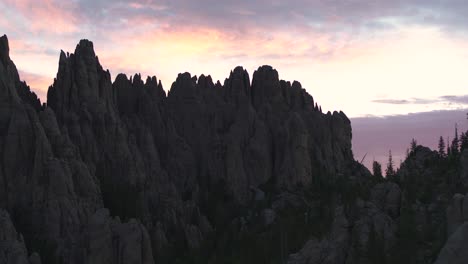 Drone-flying-over-granite-peaks-in-Custer-State-Park-in-South-Dakota-during-sunset