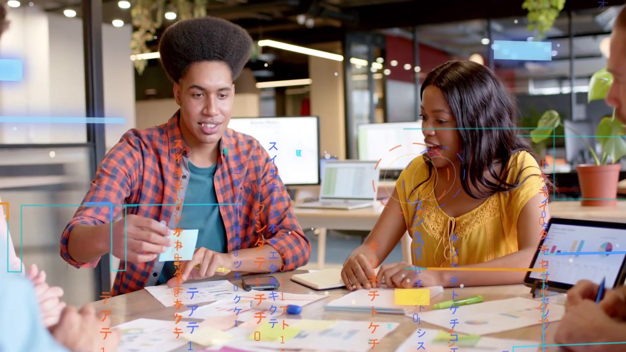 Arranging cards, plaid-shirt man and yellow top woman sorting ideas at shared table with UI overlay
