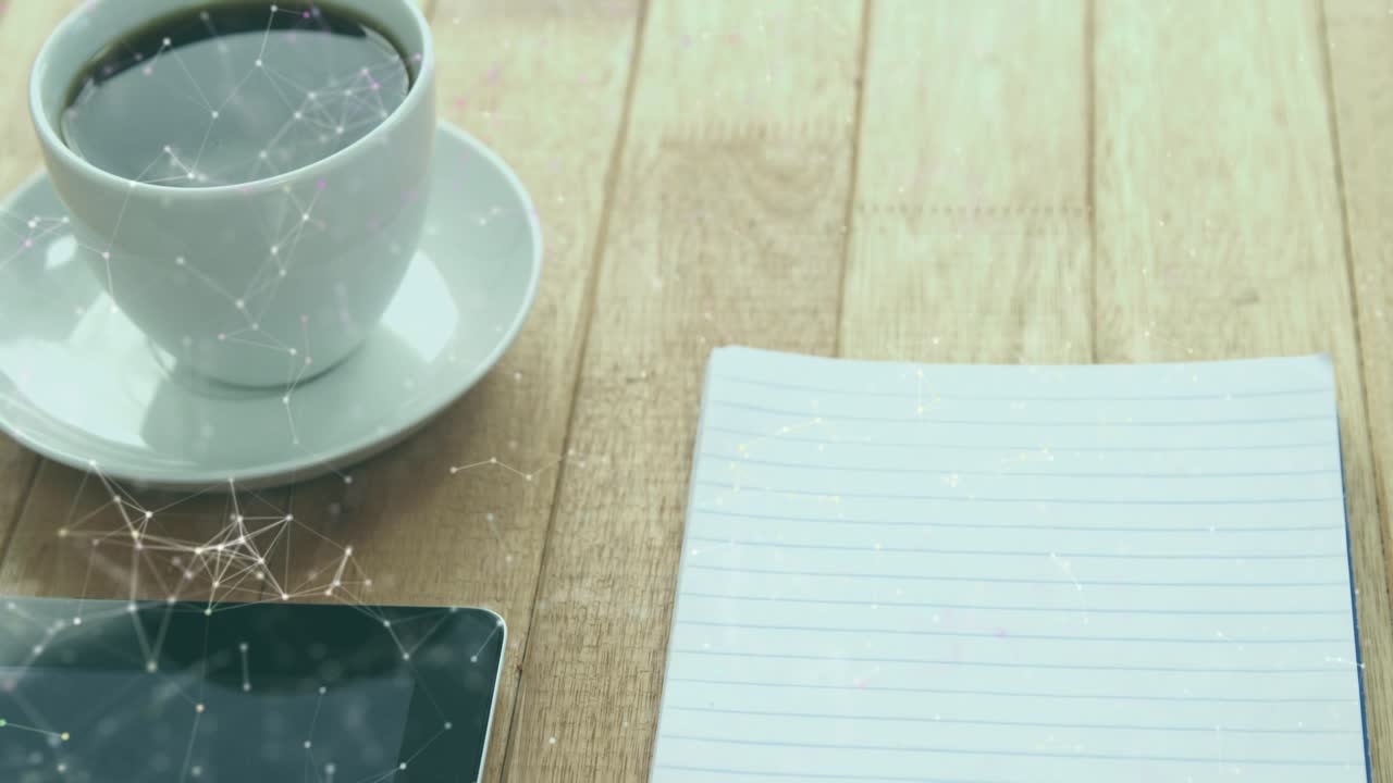 Network nodes drifting across desk causing overlay animating desktop laptop smartphone connections